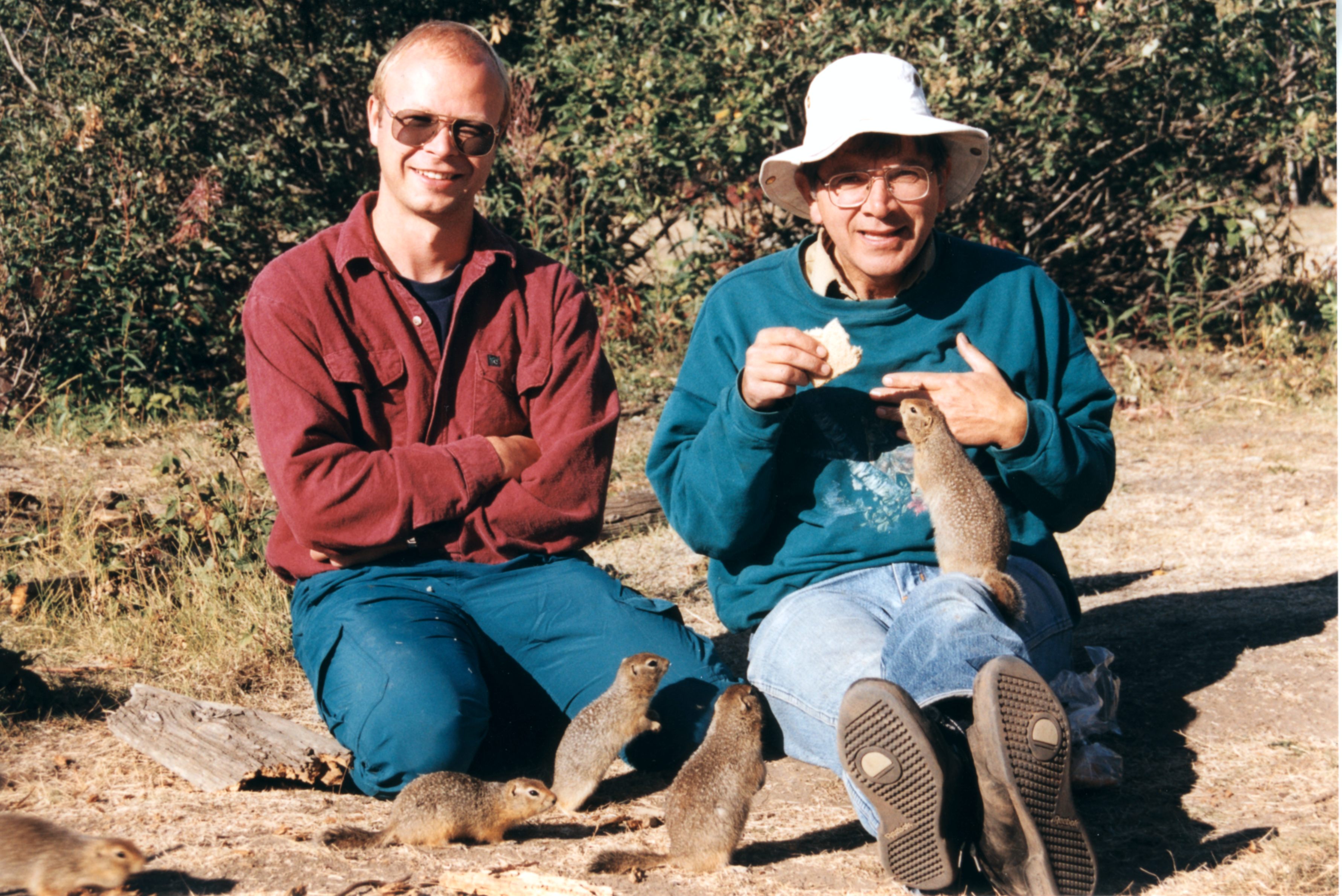 photo of Tim Karels and Rudy Boonstra surrounded by Arctic ground squirrels
