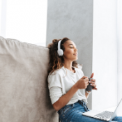Women listening to music with headphones.