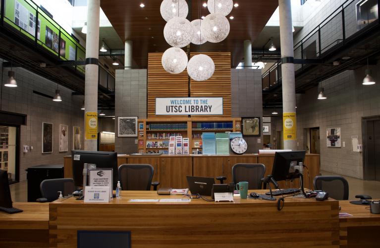 Image of the desk at the front of the library with a banner reading "Welcome to UTSC Library"